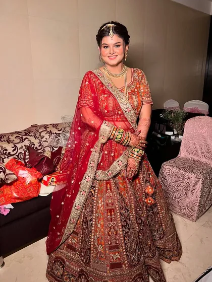 The complete bridal look, with the dupatta perfectly draped, ready for the wedding.