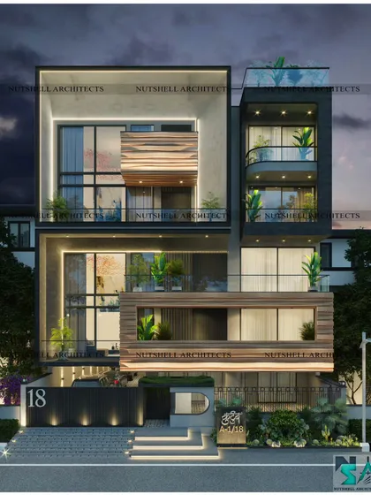 This facade is defined by its 'floating balcony,' which is wrapped in crushed copper metal for a unique, textured effect. The design features two stacked duplex units, each with its own double-height drawing room, creating a sense of vertical space and luxury.