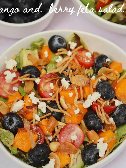 A refreshing Mango and Berry Feta Salad. This dish combines sweet mangoes, juicy berries, and salty feta for a light and flavourful salad that's perfect for summer.