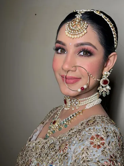 The complete look with the nath and dupatta. This bride looks absolutely stunning in her pastel outfit, a perfect inspiration for a daytime wedding.