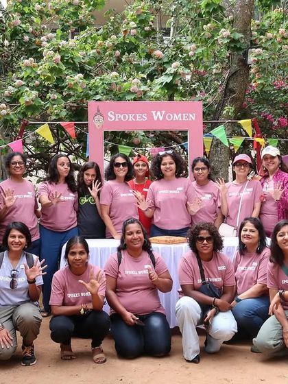 The team waving for a photo at the Garage Sale. Our matching pink T-shirts create a strong sense of belonging and make our volunteer crew easy to spot.