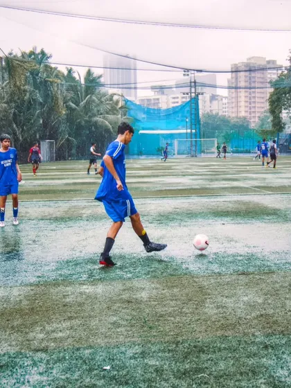 Our players competing on a rainy day at the Orlem Turf during the Independence Cup. This image shows our commitment to playing and training in all conditions, building resilience in our young athletes.