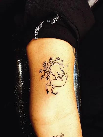 A whimsical, illustrative-style deer tattoo. This design has a storybook quality, showing our versatility in different artistic styles.