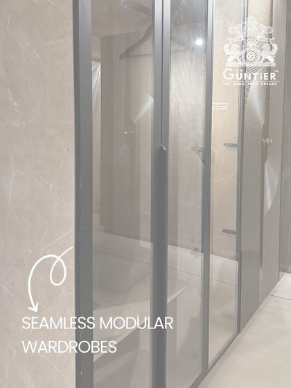 This seamless modular wardrobe with frosted glass doors offers a sleek and modern storage solution that keeps your space feeling open and uncluttered.