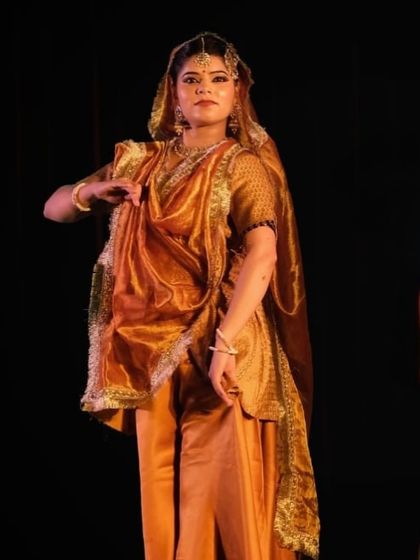 This image captures the delicate hand gestures, or 'mudras', that are a vital part of Kathak storytelling. Each mudra has a specific meaning, helping to build the narrative of the performance.