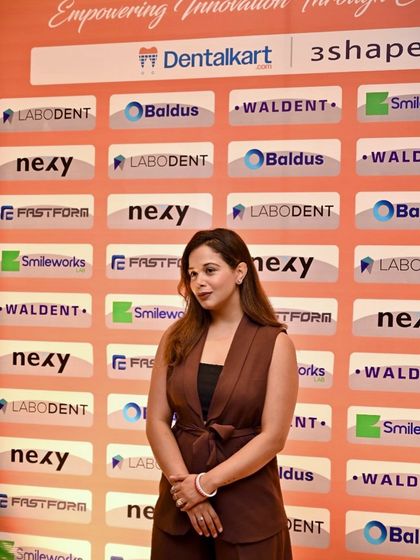 Posing against the sponsor wall after hosting an event for Dentalkart, a leading dental company in India.