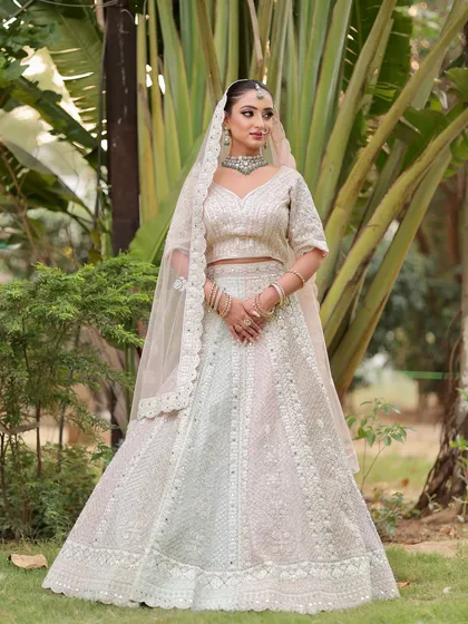 This look is all about timeless beauty. The combination of a dewy base, defined eyes, and soft lips creates a perfect bridal look.