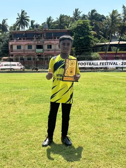 Another shot of our star player, Kanak, with his trophy on the field in Goa.