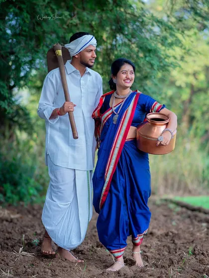 A posed shot that still feels natural and relaxed. The couple looks out towards the light, creating a hopeful and beautiful portrait within the Shetkari theme.
