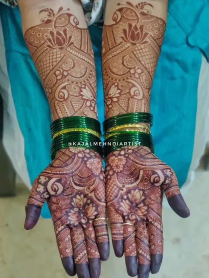 The beautiful result of a bridal henna application. The deep, rich stain highlights the intricate lotus and peacock designs.