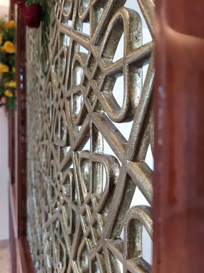 A close-up of a custom brass partition we created for a residential project. These decorative screens are an excellent way to divide spaces while maintaining an open feel and adding a touch of artistic, metallic elegance.