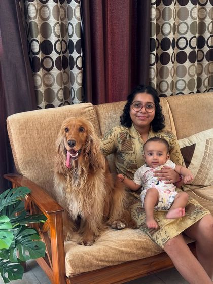 A sweet photo of Posto with his baby cousin and human cousin. He's so gentle with all the kids.