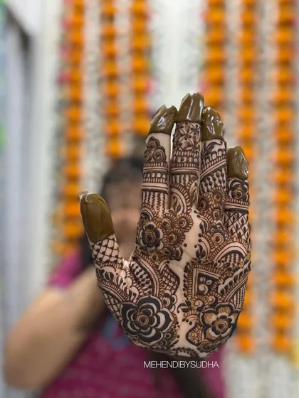 A creative shot focusing on the intricate details of the palm design in this Indo-Arabic piece.