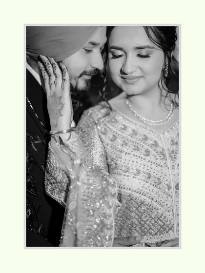 A timeless black and white portrait of Sahib and Ravleen. The soft, intimate moment highlights their emotional connection, making it a classic shot.