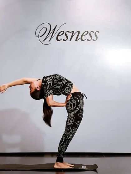 Yoga gives time, it doesn't take it. Here I am demonstrating a deep backbend at a brand event, combining my love for the practice with stylish and functional athleisure.