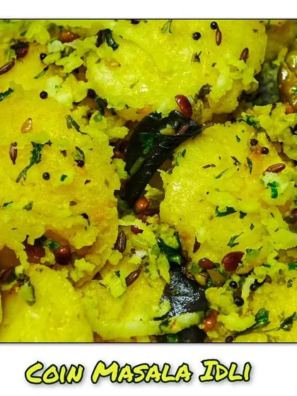 A plate of chatpata Coin Masala Idli, a savory and tangy snack that's both light and flavorful.