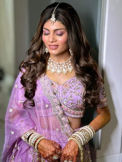 A close-up of the purple-toned smokey eye. It's a bold choice that pays off beautifully, creating a truly memorable bridal look.