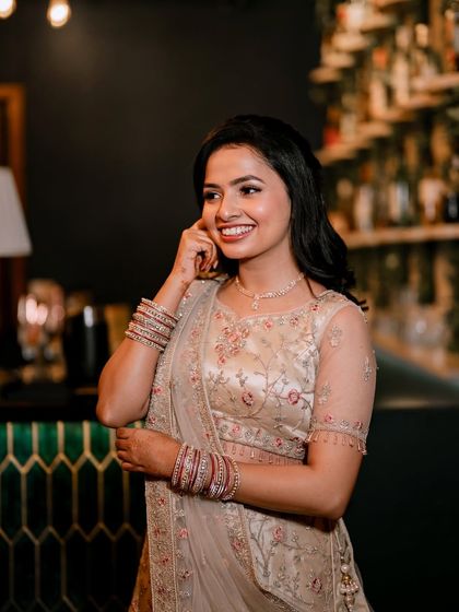 A candid, smiling shot. The makeup is designed to look great in person and in professional photos, capturing the joy of the moment.