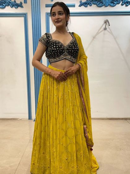 A smiling shot that captures the joy of the occasion and the beauty of the outfit.