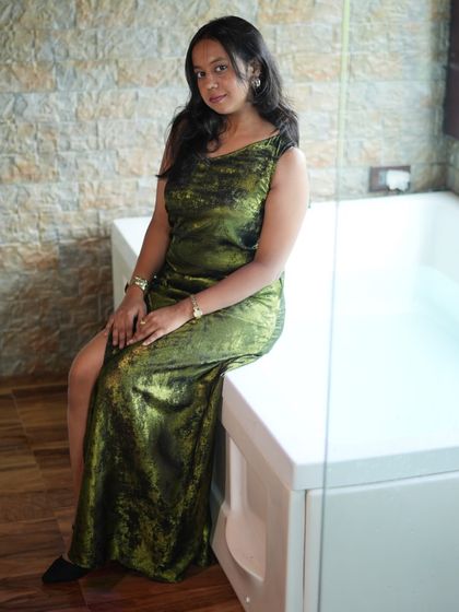 A stylish and affordable option for your next party. This green velvet gown looks much more expensive than its rental price.