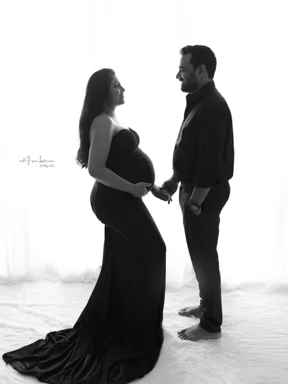 A full-length silhouette of the couple, showcasing their connection against a clean, bright background. This minimalist approach creates a powerful and emotionally resonant portrait.