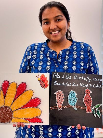 This participant created two beautiful string art pieces in our workshop, one featuring birds on a branch and the other a vibrant flower.