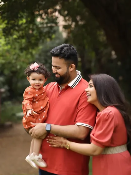 A moment of admiration. The way this little girl looks at her parents is pure love. Outdoor sessions allow for natural interactions and beautiful, light-filled portraits.