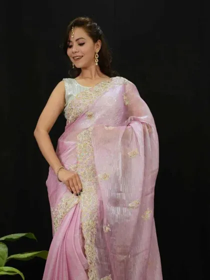A delicate and ethereal light lavender organza saree with fine embroidery. This pre-stitched piece is incredibly lightweight and easy to manage, giving you a dreamy look effortlessly.