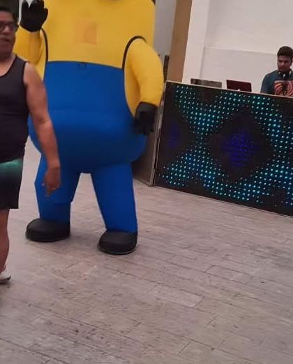 A Minion mascot stands next to the DJ booth, ready to get the party started. My characters can participate in all aspects of the party, including dancing with the guests.