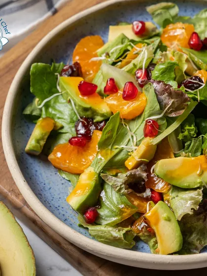 My signature salad, featuring mixed greens, avocado, orange segments, and pomegranate seeds, is a feast for the eyes and the palate. It's the perfect light and refreshing counterpoint to richer dishes.