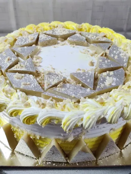 A Kaju Katli cake, another one of my special Indian fusion flavors. The cake is decorated with pieces of the popular cashew fudge.