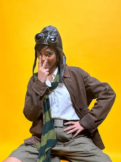 Another playful pose from the 'Faramōsh' shoot. The makeup was designed to be expressive and work with the quirky, vintage-inspired styling.