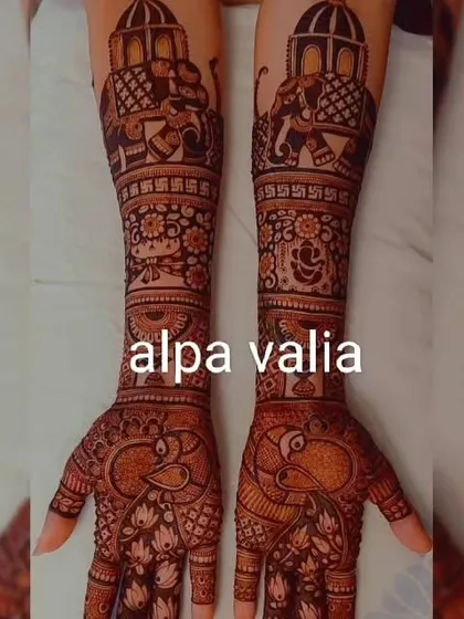 A complete view of the royal bridal mehendi, showing both hands from palm to elbow. The design is balanced and full of detail.
