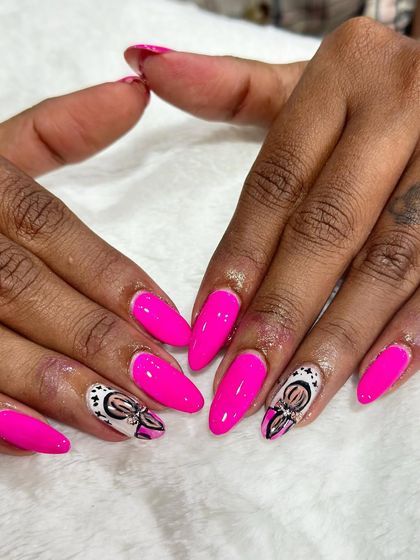 A vibrant pink set with custom art on the accent nails.