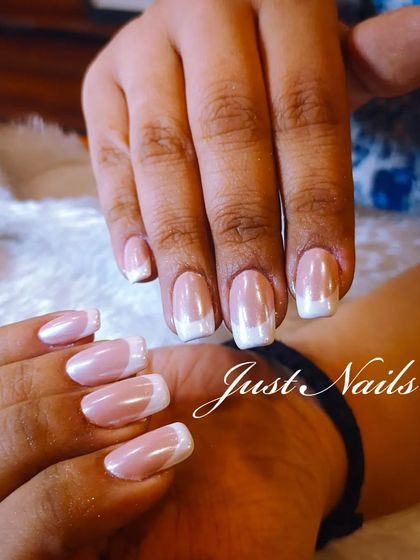 A still image of the beautiful pearlescent French manicure.