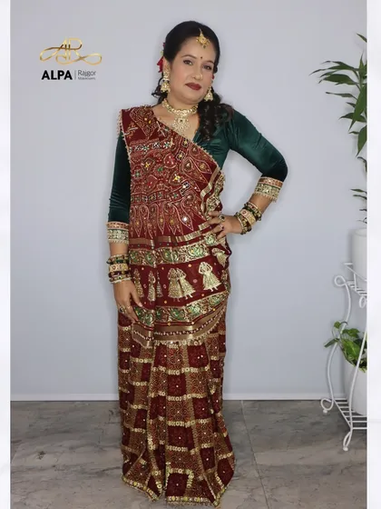 The full traditional Gujarati look, showing the beautiful bandhani saree and how the makeup complements the rich, ethnic attire.