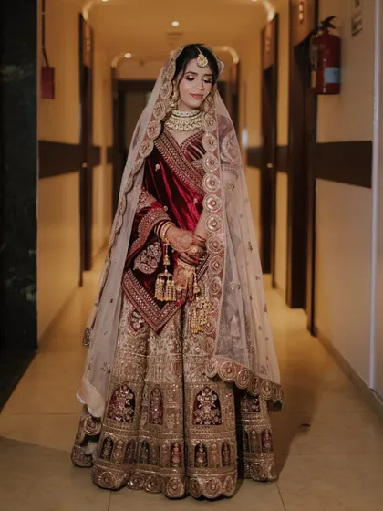 Another full-length shot, showing the bride looking serene and beautiful. The draping of the dupatta is done perfectly.