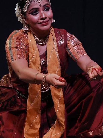 A beautiful, expressive moment from the 'Rasayatra' Abhinaya recital. The dancer's posture and gaze tell a story, drawing the audience into the narrative.