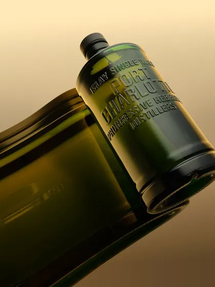 A conceptual shot playing with the form of the Port Charlotte bottle. By using a flexible mirror, I created this "unfurling" effect, as if the bottle is melting or flowing. It’s a creative experiment in pure photography, no digital manipulation.