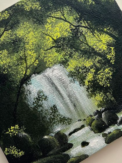 A close up of the mini waterfall painting, showing the detail in the foliage and the water.
