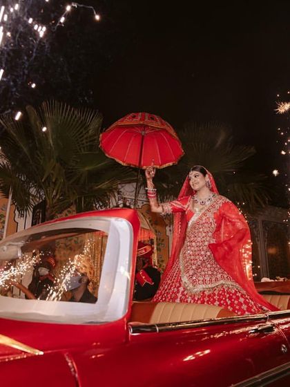 The bride's entry is one of the most anticipated moments. I planned this grand arrival in a vintage car, complete with sparklers, to make sure her first appearance was as glamorous and special as she is.
