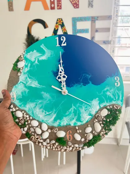 This is one of my favorite custom resin art pieces, a beach-themed wall clock. You can learn to make your own in a workshop or commission a unique piece for your home, complete with real sand and shells.