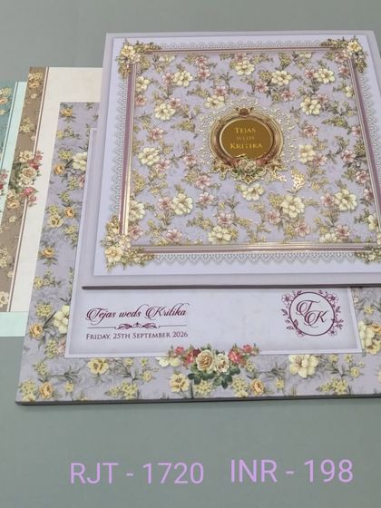 A lovely invitation with a dense floral pattern in pastel purple and yellow. The design is cheerful and romantic, perfect for a spring wedding.