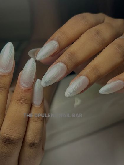 Another shot of these stunning pearl chrome nails. The almond shape and iridescent finish are a perfect match.