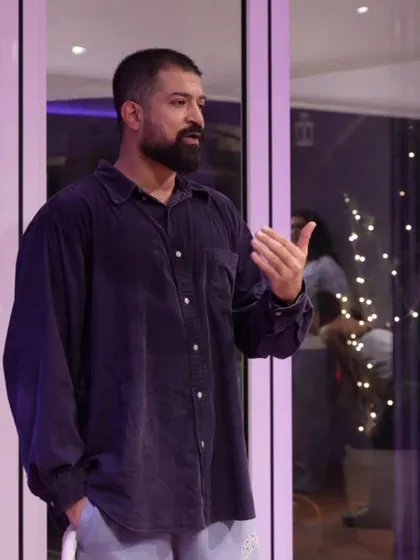 A candid moment of me speaking. This reflects the connection between my dance journey and my personal growth.