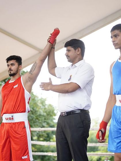 The moment of victory. A referee raises my arm after a win in an amateur boxing bout. I lead by example and bring my own competitive experience into my coaching.