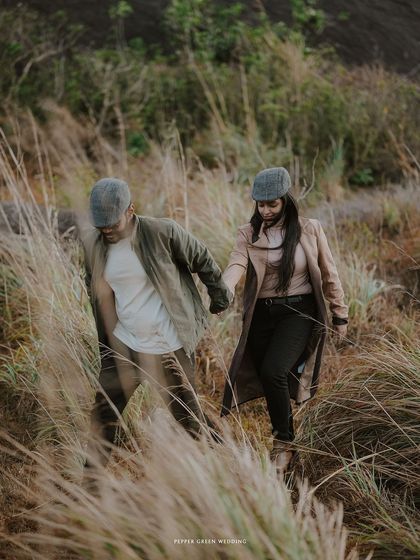 An adventurous shot of Ananthu and Sarga exploring the wilderness hand-in-hand. This shows a different style of pre-wedding shoot, perfect for couples who love the outdoors.
