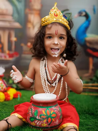 This is the pure, unfiltered joy I aim to capture. This little Kanha, having the best time with his pot of 'makhan' during our Janmashtami mini-session, is the perfect example of the fun, candid moments we create.