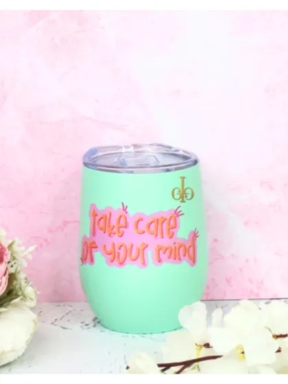 Our nano tumbler in mint green, personalized with a "take care of your mind" graphic. It's a great reminder to practice self-care while you hydrate.
