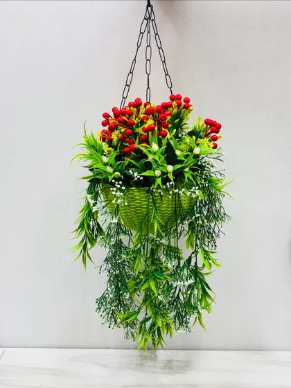 This vibrant hanging basket, filled with artificial red berries and cascading greenery, is a perfect, ready-to-install decor piece for adding a pop of color to balconies, patios, or entryways.